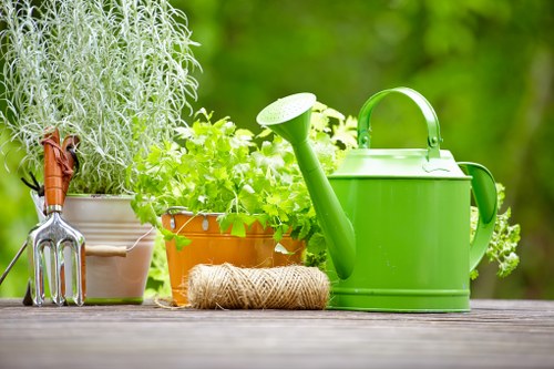 Professional gardener tending to plants in Gunnersbury